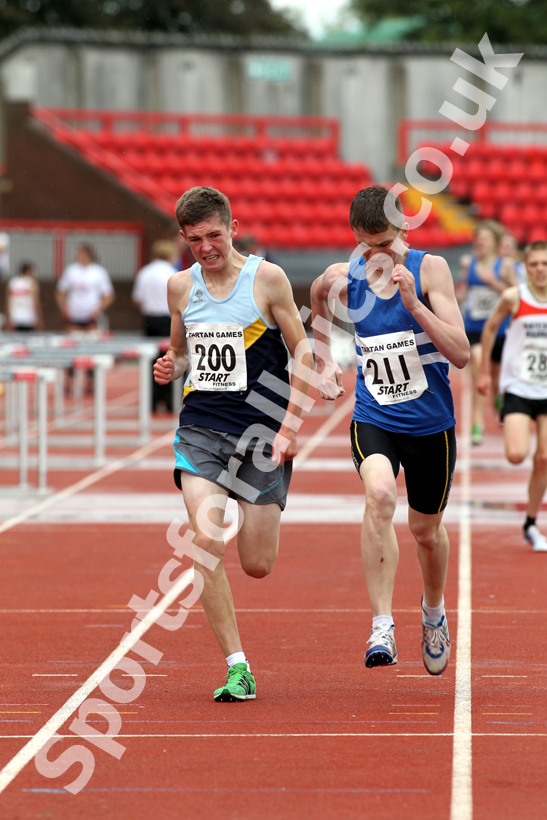 200 Henry Johnson (Chester-le-Street) and 211 Phillip Winkler (Morpeth Harriers), Under-15s 1500 metres, Gateshead Tartan Games